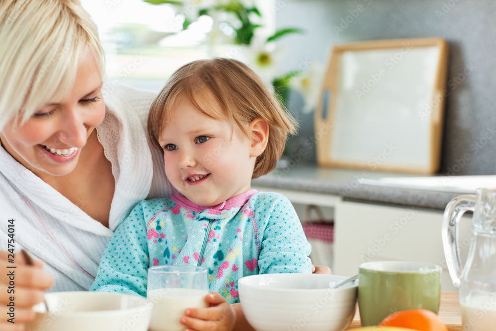 Simper mother having breakfast with her daughter Simper mother having breakfast with her daughter
