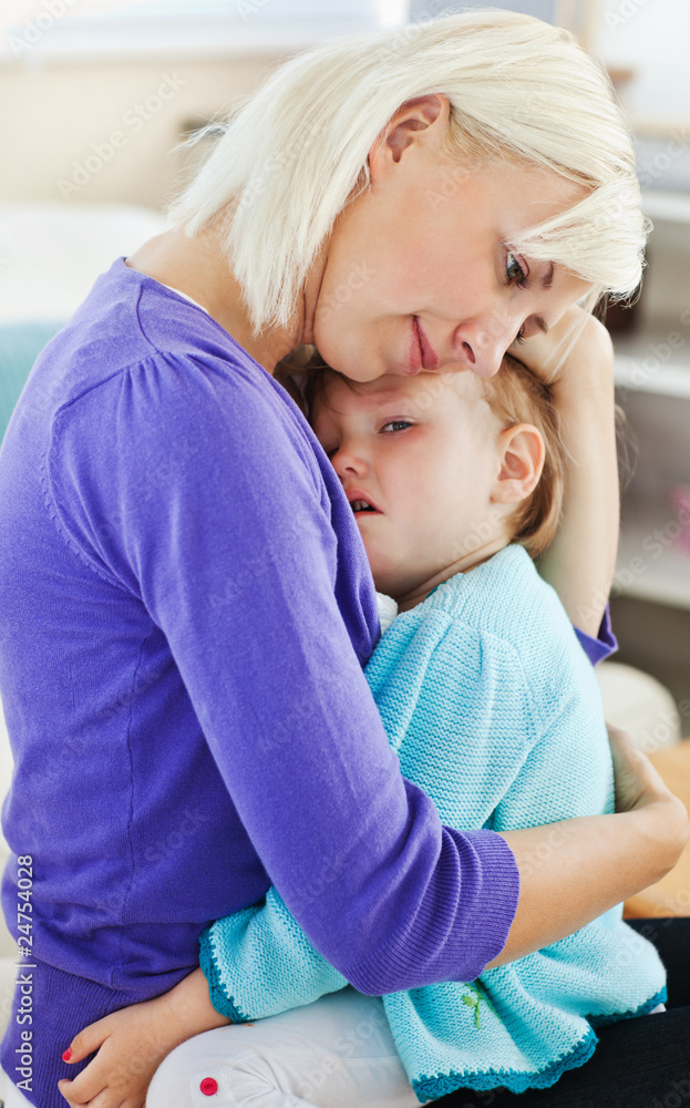 Fototapeta premium Blond woman taking care of her child