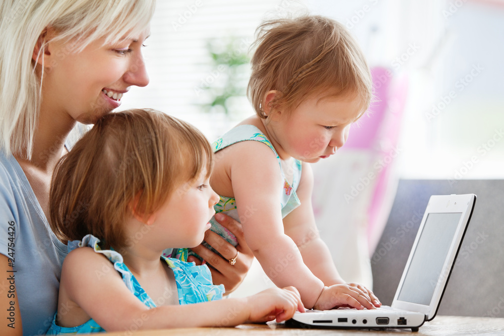 Enthusiastic family having fun with a laptop Enthusiastic family having fun with a laptop
