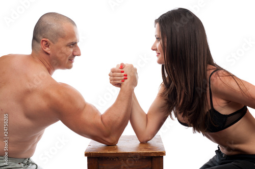 Фотография Man and woman arm wrestling