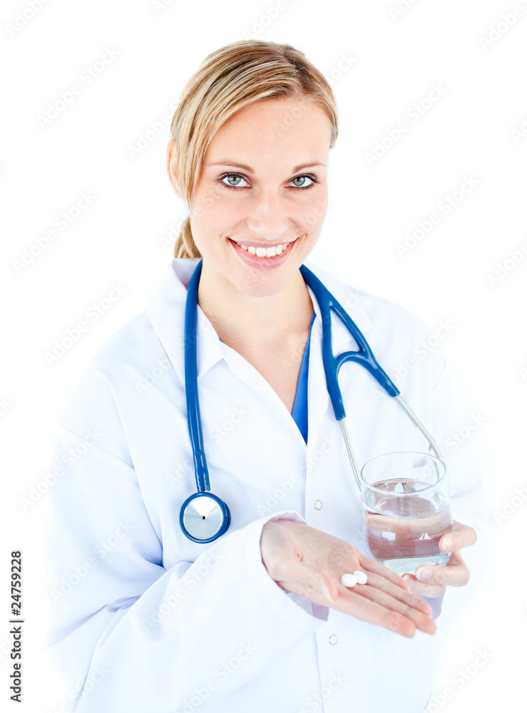 Pretty female doctor holding pills and water Pretty female doctor holding pills and water