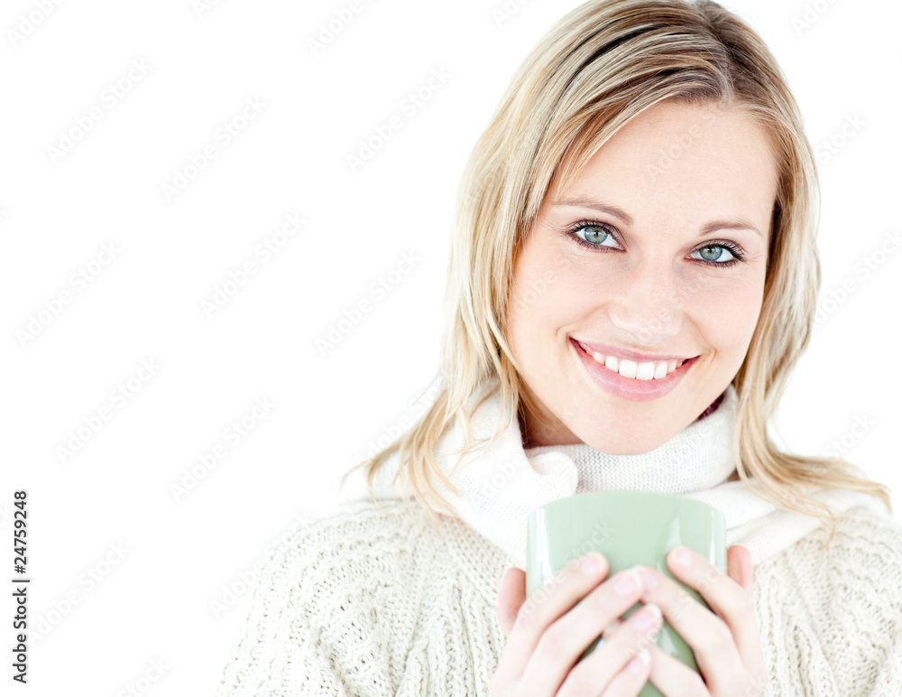 Relaxed woman holding a cup of coffee standing Relaxed woman holding a cup of coffee standing