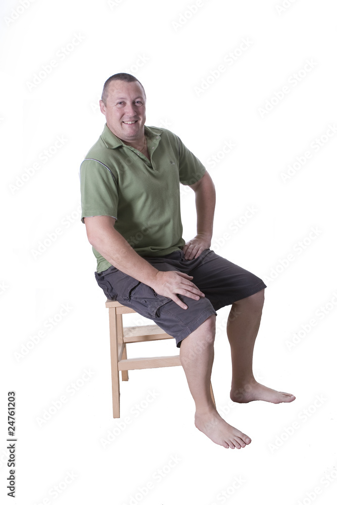 sitting man in green top sitting man in green top