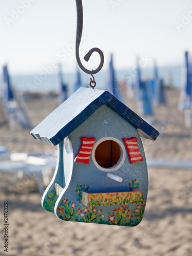 Bird house on the beach photo