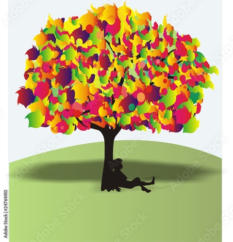 The boy under a wonderful colour tree