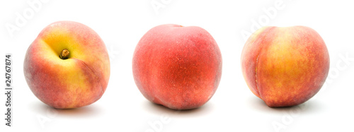 three ripe red peaches isolated on white background;