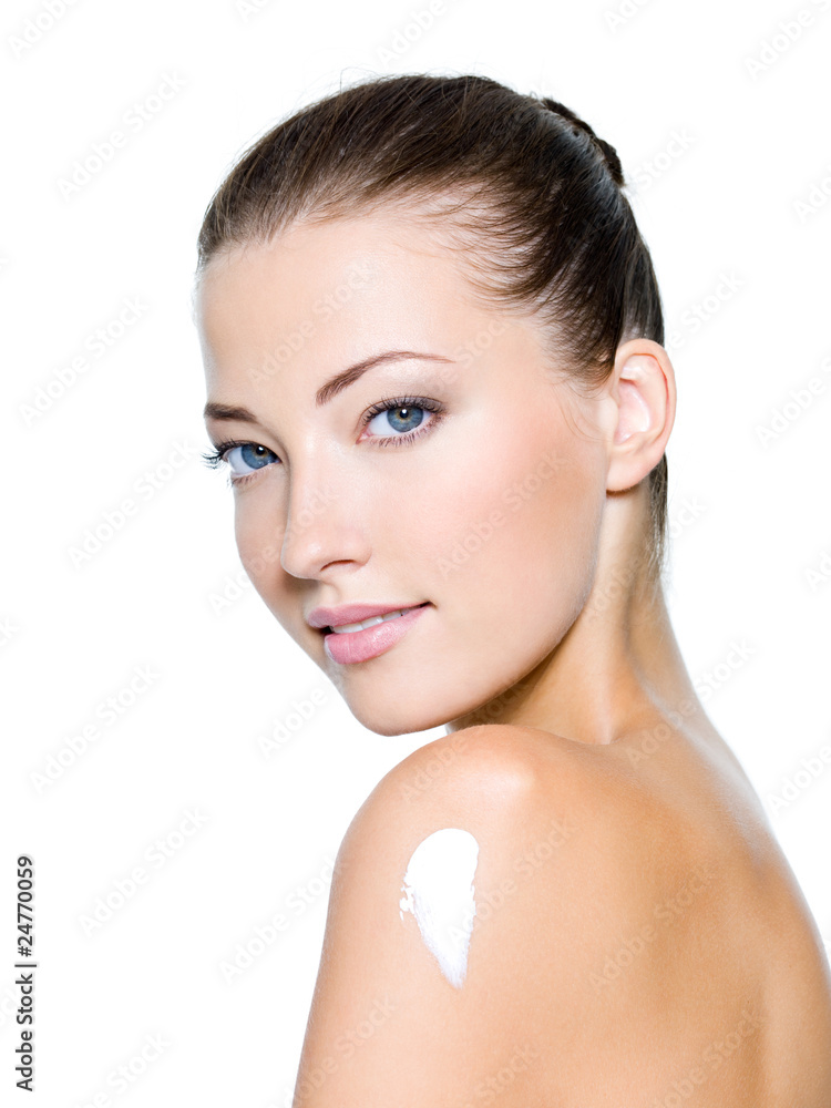 Fototapeta premium woman with moisturizer cream on shoulder