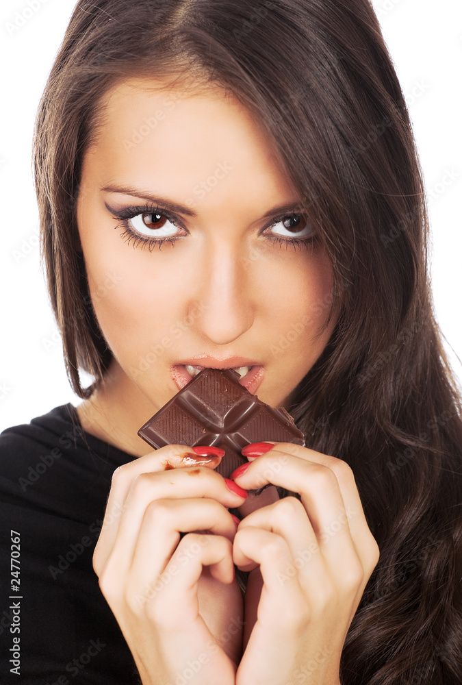 Portrait of young woman eating chocolate Portrait of young woman eating chocolate