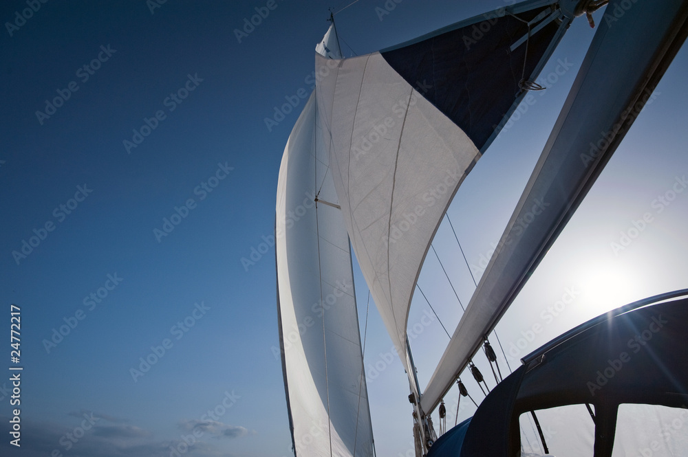 wind in yacht sails with beautiful cloudless sky