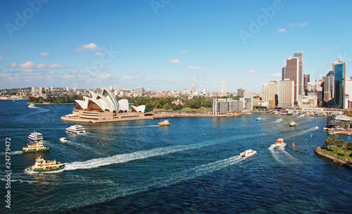 Sydney opera house with ferrys in foregournd