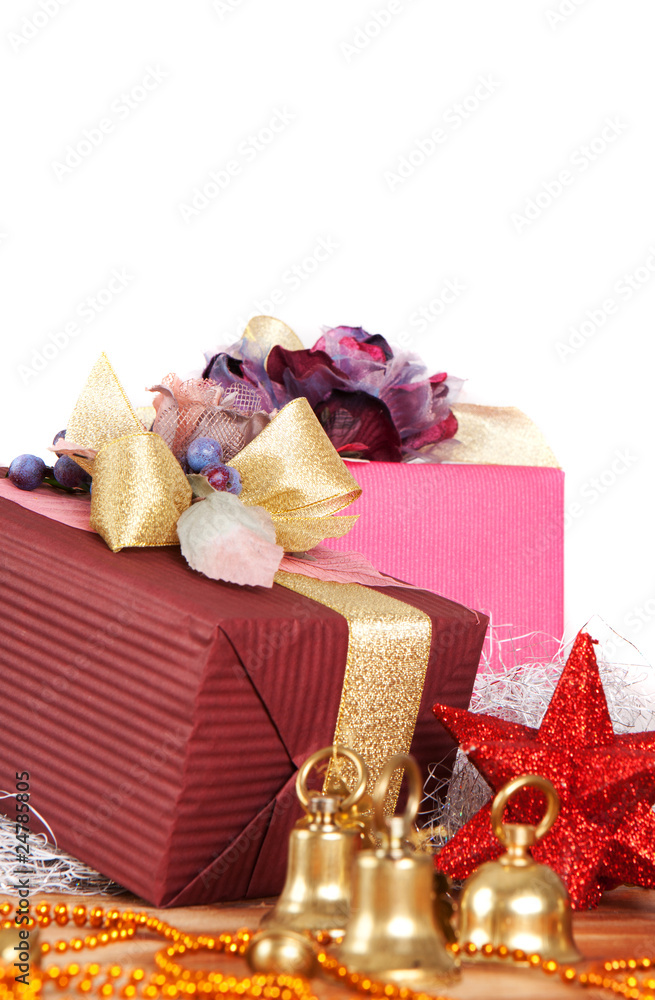 Christmas presents and ornaments over white background Christmas presents and ornaments over white background