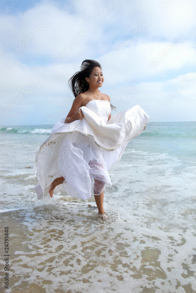 Bride Running Through the Ocean in Wedding Dress Bride Running Through the Ocean in Wedding Dress