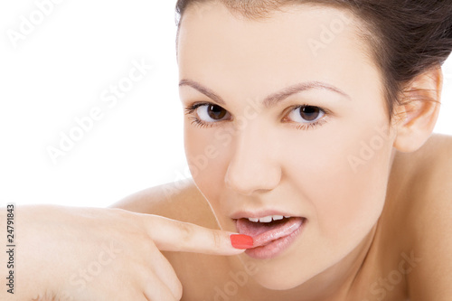 Brightly picture of sexy female face with finger in mouth