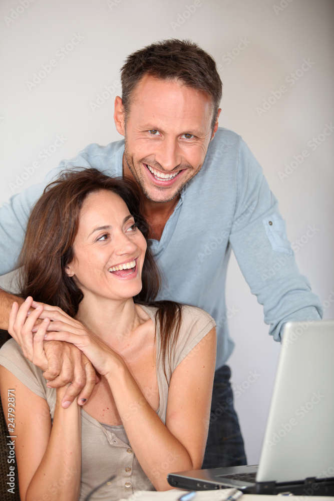 Couple at home surfing on internet Couple at home surfing on internet