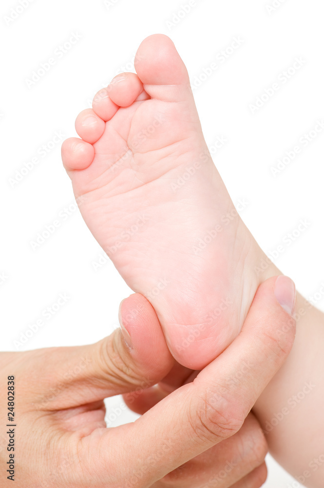 making massage of child's foot - isolated making massage of child's foot - isolated