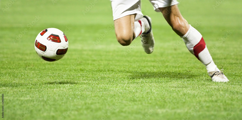 Soccer player running after the ball Soccer player running after the ball