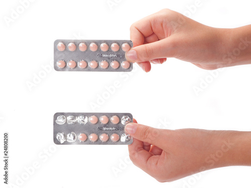 two medical pills container on a female hand, isolated