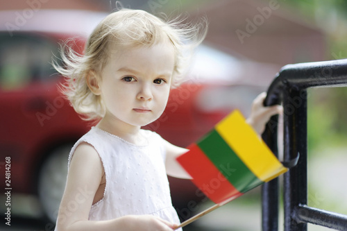 Adorable toddler girl with lithuanian flag photo