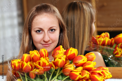 attractive blonde holding bunch of flowers