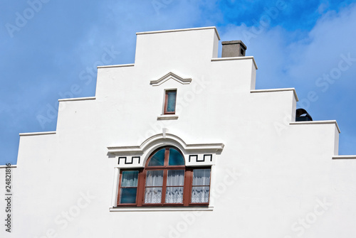 White building with decorated windows
