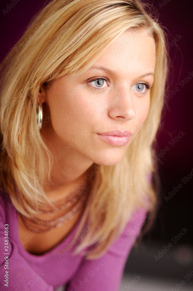 Atractive blonde woman in violet sweater Atractive blonde woman in violet sweater