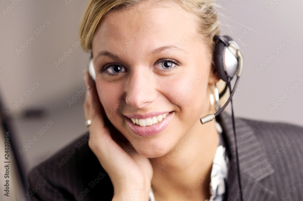Atractive businesswoman in black two-piece suit with headphone Atractive businesswoman in black two-piece suit with headphone