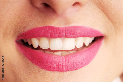 Woman's seductive lips with pink lipstick