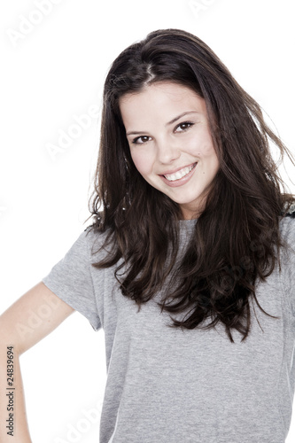 Portrait of a smiling girl in a grey shirt
