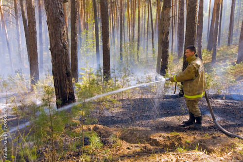 Fireman in forest fire in Russia