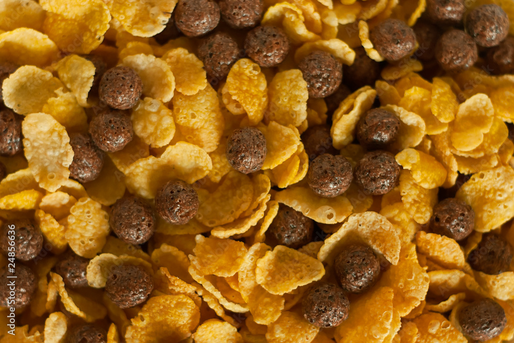 Cornflakes and cocoa balls background. Cornflakes and cocoa balls background.