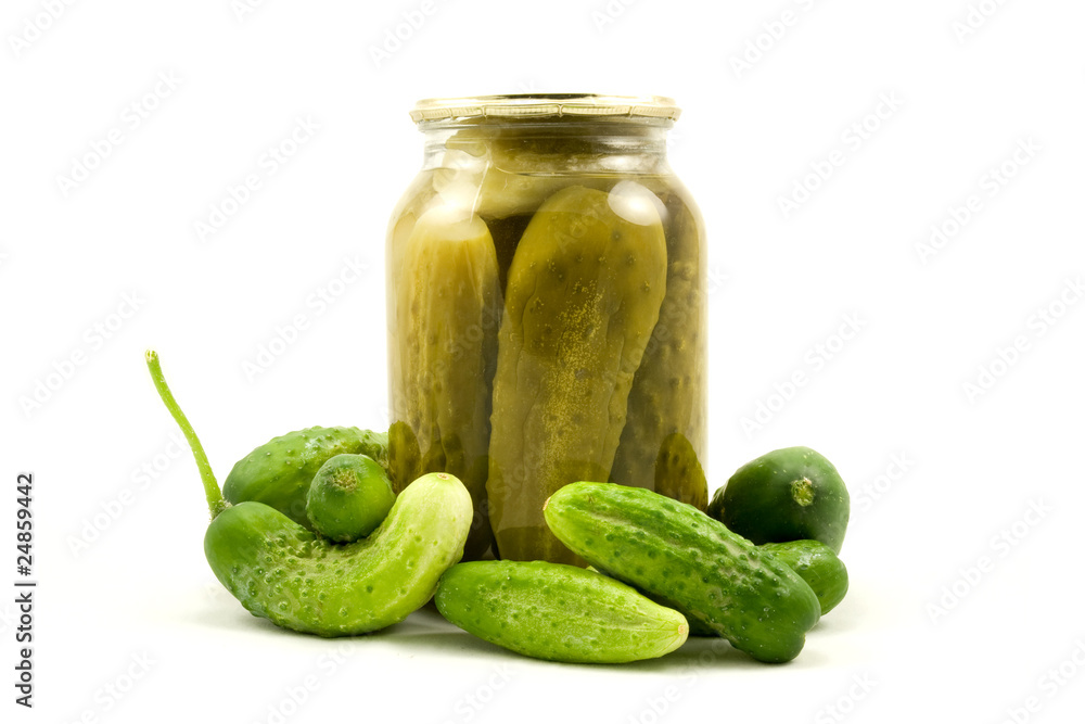 Glass jar with cucumbers on a white background Glass jar with cucumbers on a white background
