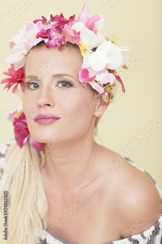 Attractive woman with flowers wrapped around her head