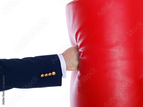 businessman boxing a punching bag with bare fist © Lucky Dragon USA