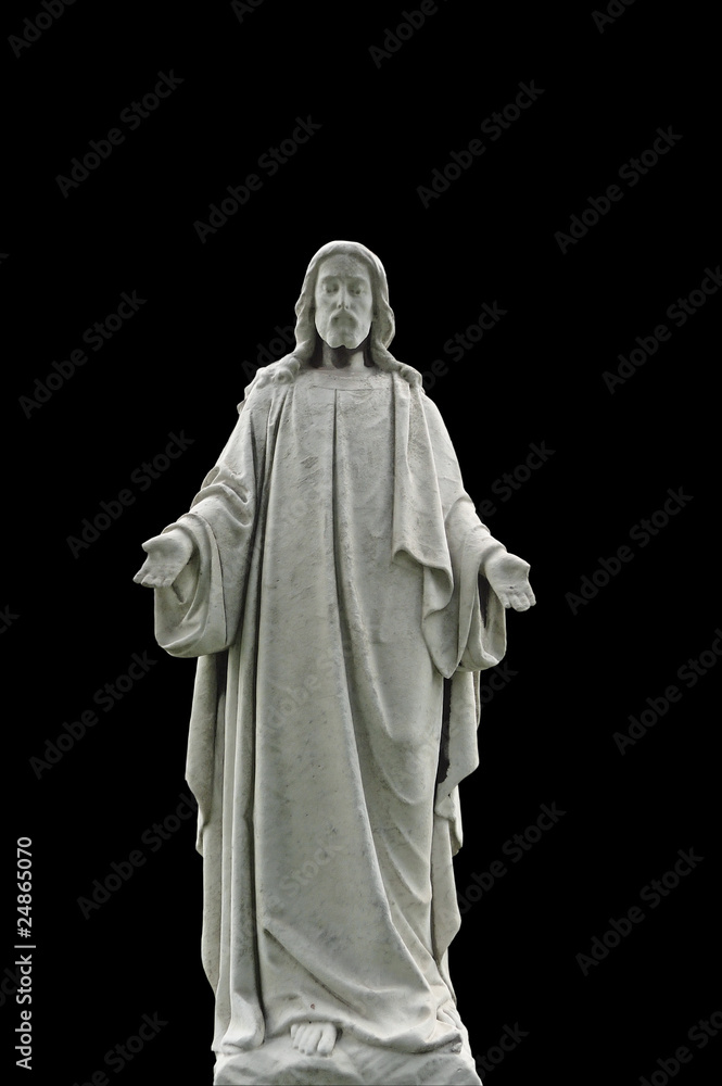 Weathered nineteenth century Jesus statue isolated on black