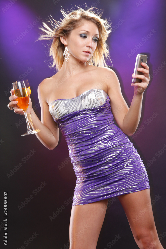 Cute model texting while having wine Cute model texting while having wine