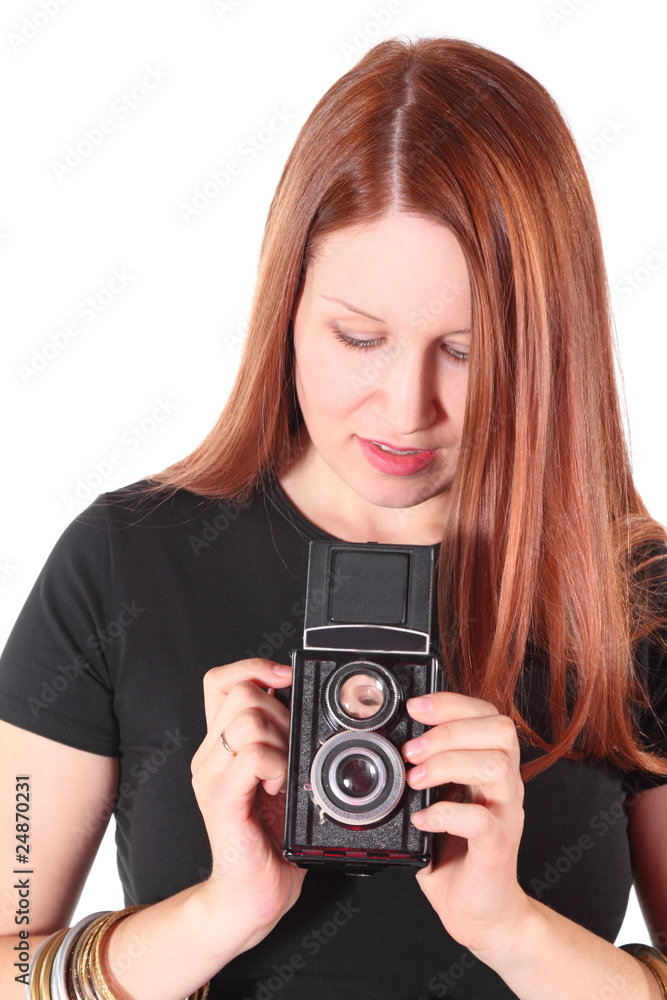 woman wearing shirt is holding old photocamera. isolated. woman wearing shirt is holding old photocamera. isolated.