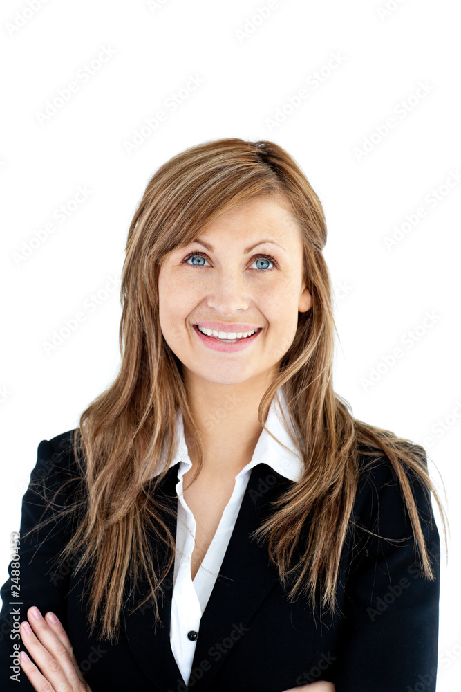 Cheerful businesswoman with folded arms looking upwards Cheerful businesswoman with folded arms looking upwards