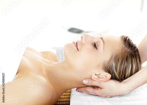 Glowing young woman  enjoying a massage