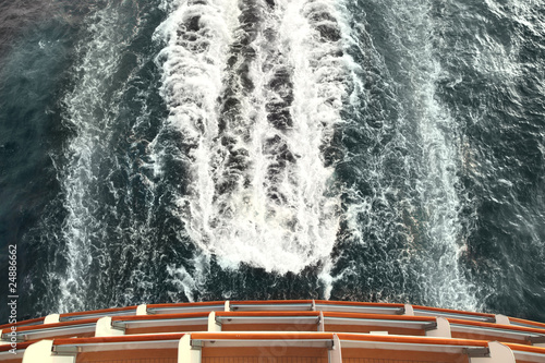 ship deck and trail with waves and foam in ocean view from above