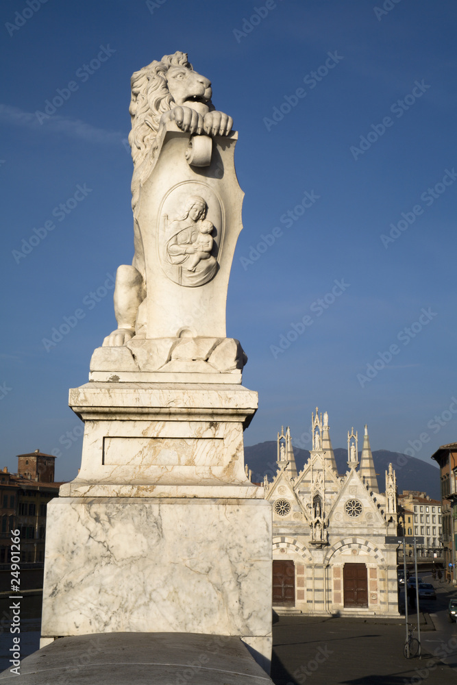 Pisa - lion on the waterfront and gothic chapel