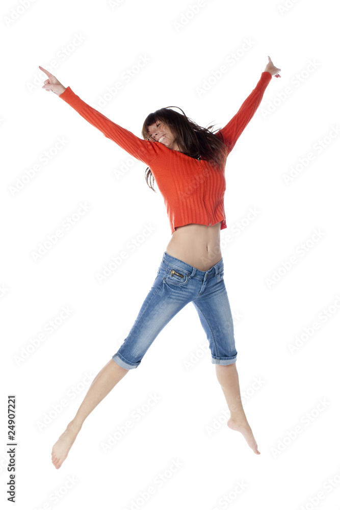 jeune fille sautant en l'air bras jambes en croix Stock Photo