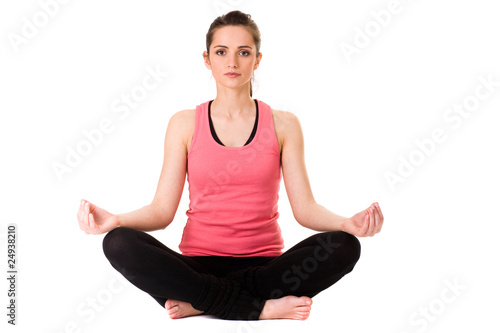 young attractive female in yoga meditation pose, isolated