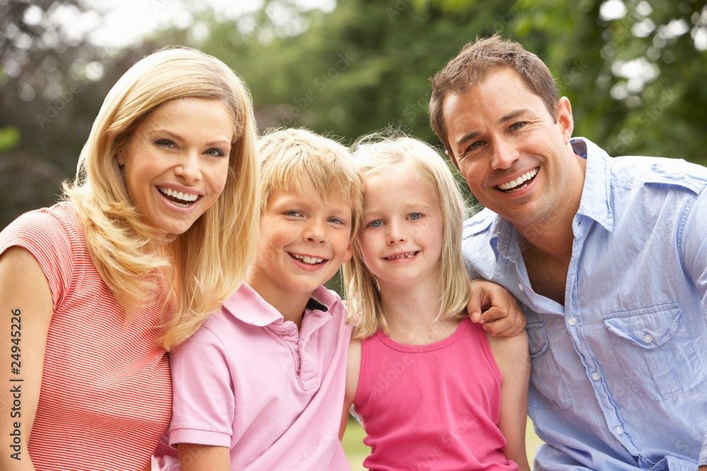 Portrait Of Family Relaxing In Countryside Portrait Of Family Relaxing In Countryside
