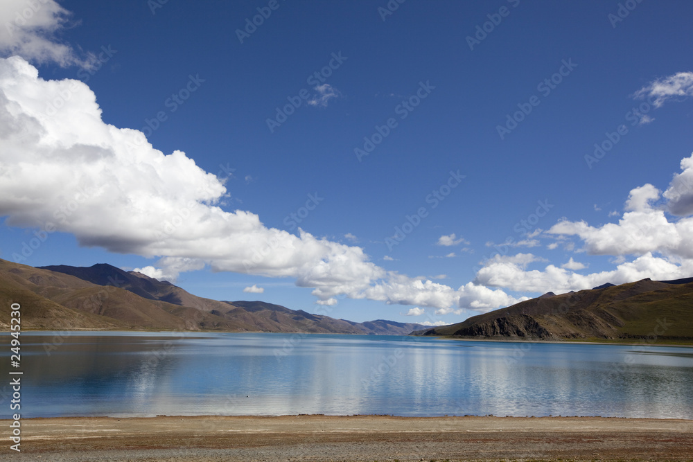 tibet: yamdrok yumtso lake with dramatic clouds