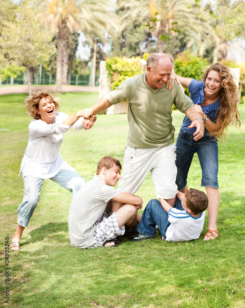 Family holding back grandfather