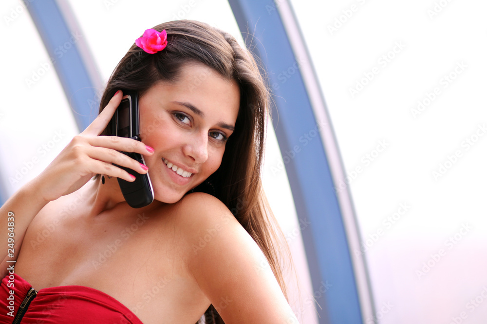 Fototapeta premium woman in red dress calling by phone