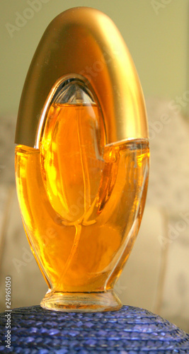 Perfume in a beautiful glass with gold top