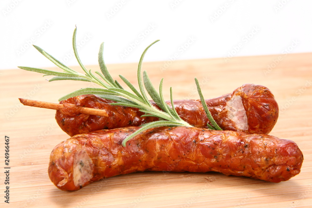 Traditional sausages with rosemary twig