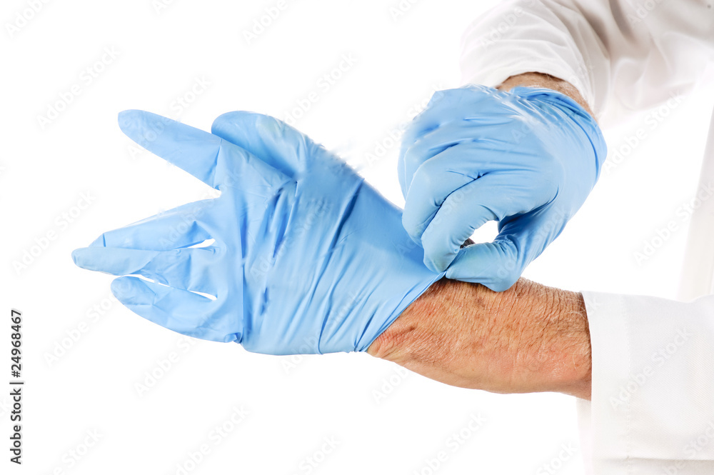 health worker putting on nitrile glove health worker putting on nitrile glove