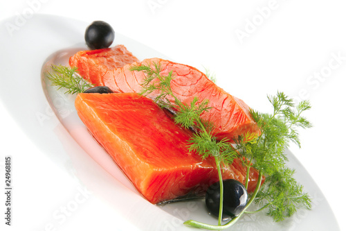 smoked salmon on white plate with olives
